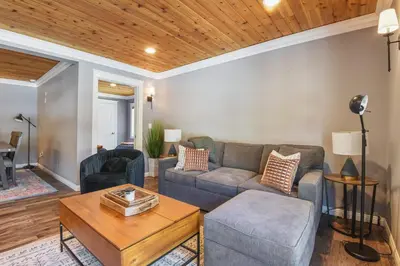 a living room with a couch and a table at Alpine Chalet Nature Lovers Rejoice Chic 4 BDR in Alpine Meadows