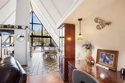 a living room with a couch and a table at Woodside Hideout - Hop Away from Activities in Tahoma