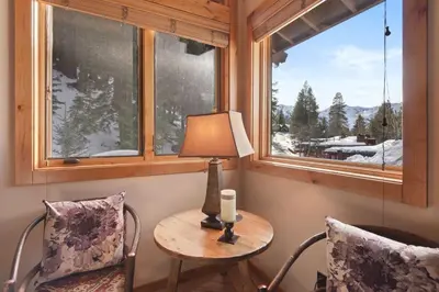 a room with a table and two chairs and a window at Wulf's Lodge at Olympic Valley - Unwind in Hot Tub in Olympic Valley
