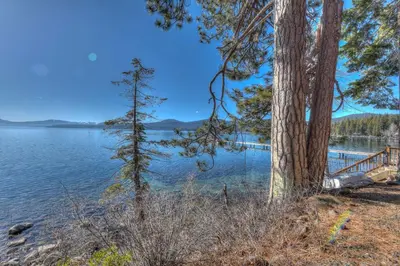 a view of a lake with trees and a dock at Brockway Springs Lodge Steps to Lake Access in Kings Beach