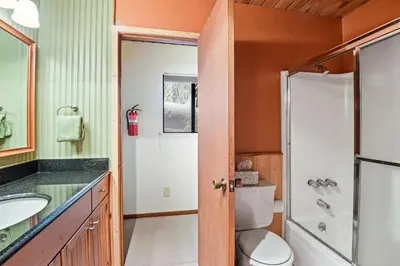 a bathroom with a toilet and a sink at Comfy Alpine Meadows Endless fun in Alpine Meadows