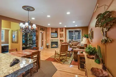 a large living room with a fireplace and a dining room at Crystal Charm Amazing 3 BDR Condo Close to Beaches Casinos & Skiing in Crystal Bay