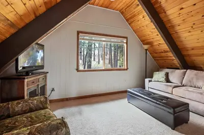 a living room with a couch and a tv at Incline Cottage Year-Round Outdoor Fun in Incline Village