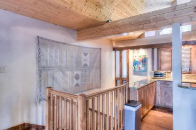 a wooden staircase in a room with a wooden ceiling at Crystal Shores Villa Lake Views & Hiking in Incline Village