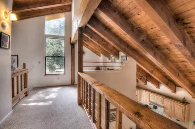 a hallway of a house with wooden ceilings at Glacier Forest Getaway HOA Access in Truckee