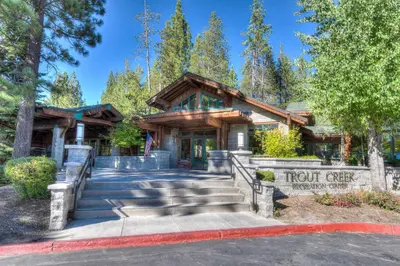a resort building with stairs leading to the front gate at Glacier Forest Getaway HOA Access in Truckee