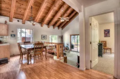 a kitchen and dining room with a table and chairs at Glacier Forest Getaway HOA Access in Truckee