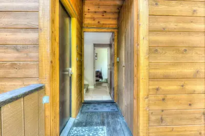 a hallway of a house with wooden doors at Lake Forest Villa Patio w BBQ in Tahoe City