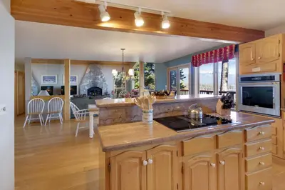 a large kitchen with a counter top and a living room at Lakeview Hideaway 3BDR for 8 w Private Hot Tub in Carnelian Bay