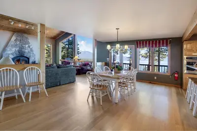 a dining room and living room with a table and chairs at Lakeview Hideaway 3BDR for 8 w Private Hot Tub in Carnelian Bay