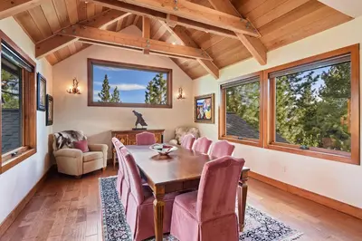 a dining room with a table and chairs at Luxury Mountain Chalet Deck w BBQ & Lake Views in Tahoe City