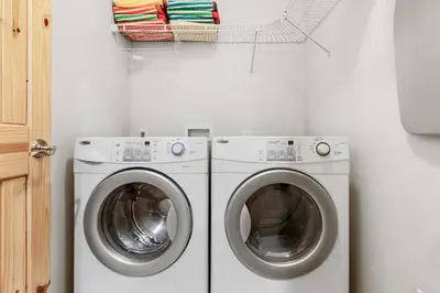 a laundry room with a washer and dryer at Modern Lake Tahoe Retreat Ski and Swim in Tahoe Vista