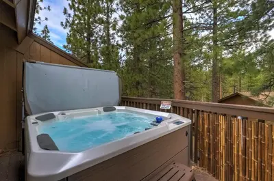 a hot tub sitting on a wooden deck with at Heavenly Haven - Hot Tub and Seasonal HOA Pool in Zephyr Cove