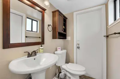 a bathroom with a sink and a toilet and a mirror at Heavenly Haven - Hot Tub and Seasonal HOA Pool in Zephyr Cove