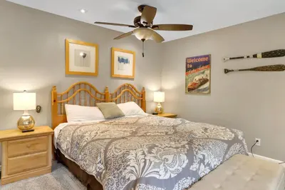 a bedroom with a bed and a ceiling fan at Heavenly Haven - Hot Tub and Seasonal HOA Pool in Zephyr Cove