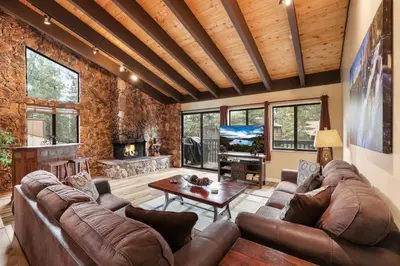 a large living room with a couch and a tv at Heavenly Haven - Hot Tub and Seasonal HOA Pool in Zephyr Cove