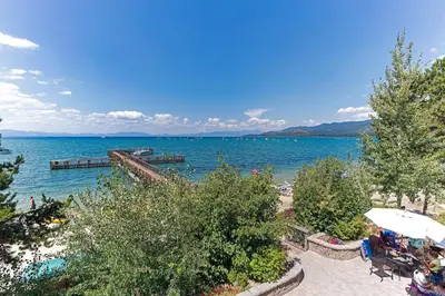 a view of a beach with a body of water at Lakeland Getaway - Walk to Lake in South Lake Tahoe