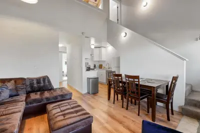 a living room with a couch and a table and chairs at Mile High Mountain - Carson Valley Views in Stateline