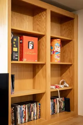 a book shelf filled with books and dvds at Montgomery Estates Bliss - Hot tub pets family fun in South Lake Tahoe