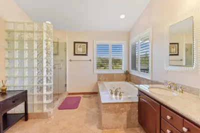 a bathroom with a tub and a sink and a shower at Mule Meadows - Classy Split level South Tahoe home in South Lake Tahoe