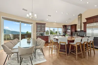 a dining room with a table and chairs in a kitchen at Yosemite Cloudline Ridge in Oakhurst