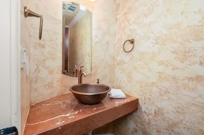 a bathroom with a bowl sink and a mirror at Yosemite Cloudline Ridge in Oakhurst
