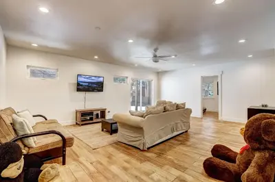 a living room with two couches and a tv at Amachen Cabin - Pet & Family Friendly - woof woof in South Lake Tahoe