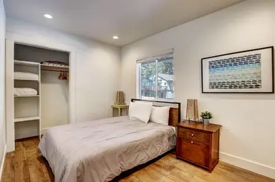 a bedroom with a large bed and a window at Amachen Cabin - Pet & Family Friendly - woof woof in South Lake Tahoe