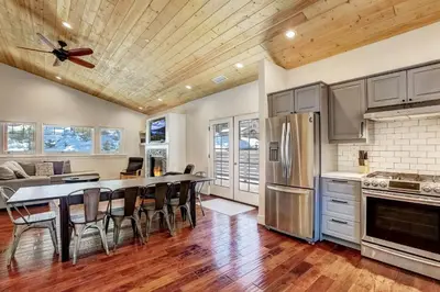 a kitchen with a table and chairs in a room at Amachen Cabin - Pet & Family Friendly - woof woof in South Lake Tahoe