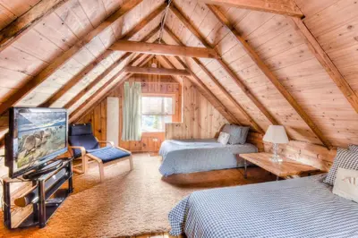 a bedroom with a bed and a tv in a room at Badger Basin - 30 Days or more Vacation Home Rental in South Lake Tahoe
