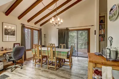 a dining room with a table and chairs at Bear Haus - Fur babies welcome in South Lake Tahoe