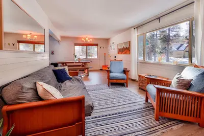 a living room with a bed and a couch at Charming Cherokee Cabin - Secluded Stay for 6 Just 10 Minutes to Tahoe in South Lake Tahoe