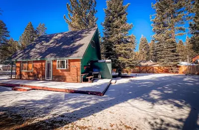 a cabin in the woods in the snow at Charming Cherokee Cabin - Secluded Stay for 6 Just 10 Minutes to Tahoe in South Lake Tahoe