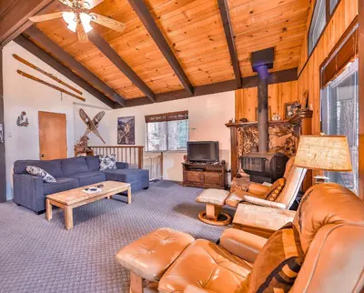 a living room with a couch and a fireplace at Cherry Hills Cabin - Sleeps 6 No Pets Family Fun in South Lake Tahoe