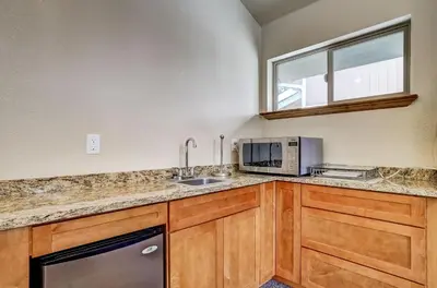 a kitchen with a sink and a microwave at Cold Creek Chalet - Hot tub & Movie Room in South Lake Tahoe