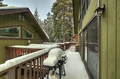 a bike parked on a porch covered in snow at Cold Creek Chalet - Hot tub & Movie Room in South Lake Tahoe