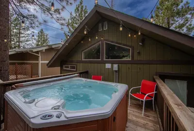 a hot tub on the deck of a house at Cold Creek Chalet - Hot tub & Movie Room in South Lake Tahoe