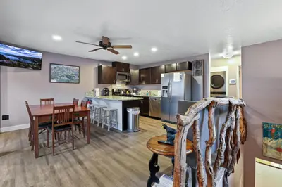 a kitchen and dining room with a table and chairs at Ski In Ski Out 3 BDR Steps from Stagecoach Lift in Stateline