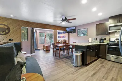 a kitchen and living room with a table and chairs at Ski In Ski Out 3 BDR Steps from Stagecoach Lift in Stateline