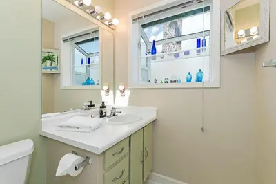 a bathroom with a sink and a mirror at Elk Forest Escape - Economy Family Abode in South Lake Tahoe