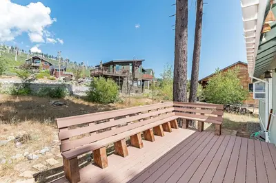 a wooden bench sitting on a wooden deck at Elk Forest Escape - Economy Family Abode in South Lake Tahoe