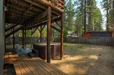 a barbecue under a pavilion in a backyard at Paloma Place Lakeview Home Hot Tub Game Room in South Lake Tahoe