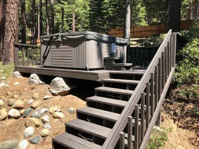 a stairs leading to a hot tub with a roof at Prima Del Norte - Hot tub Pool Table Arcade Game in South Lake Tahoe