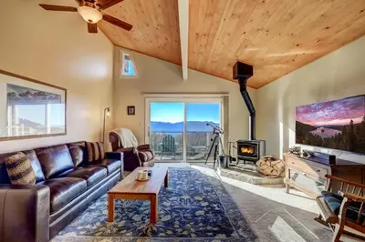 a living room with a couch and a fireplace at Scenic Escape - BEST views of Lake Tahoe in Stateline