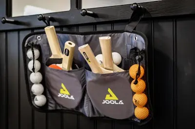 a bag full of balls and bats on a wall at Singing Pines in Marla Bay - Walk to Lake in Glenbrook