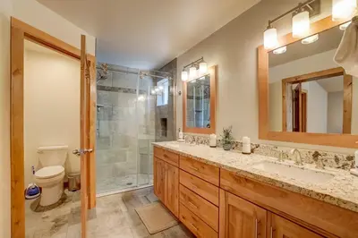 a bathroom with a shower and a sink and a toilet at Sutter Trail Sparkles - Air conditioned large family home in South Lake Tahoe