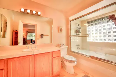 a bathroom with a toilet and a sink and a shower at Tahoe Family Getaway in Stateline