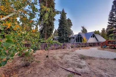 a house in a yard with a fence at Tahoe Family Getaway in Stateline