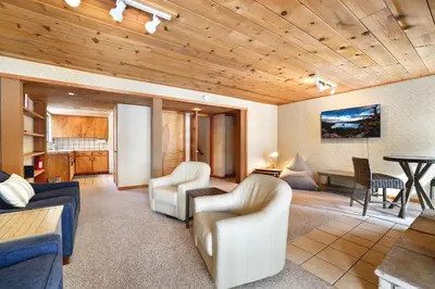 a living room with a couch and chairs and a table at Tahoe Forest Chalet 3BR House with AC in Stateline