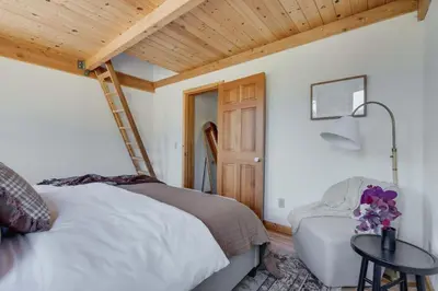 a bedroom with a bed and a wooden ceiling at North Lake Hideaway Prime Locale for Outdoor Fun in Alpine Meadows